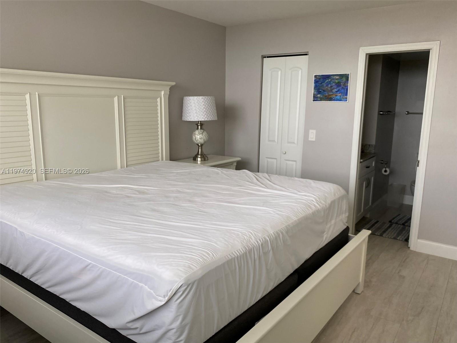 2929 South Ocean Boulevard, Unit 5090 Boca Raton, FL 33432 - Photo 10 of 25 a bedroom with a bed and closet