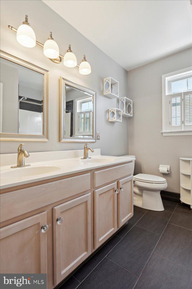 1211 Bon Air Road Havertown, PA 19083 - Photo 32 of 45 Remodeled ceramic tile hall bathroom, double sinks