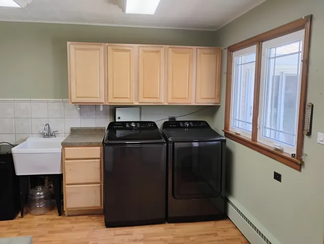 a kitchen with a refrigerator and a stove