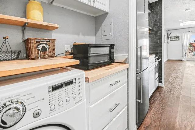 a kitchen with appliances and cabinets