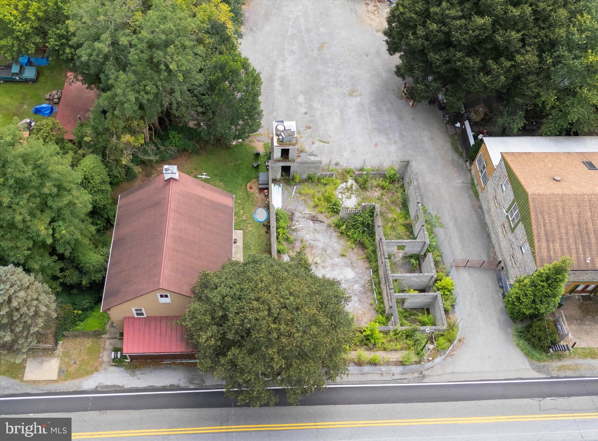 2090 Strasburg Road Coatesville, PA 19320 - Photo 4 of 13 an aerial view of a house with a yard and outdoor seating