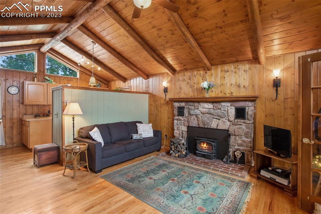 321 Dewell Road Woodland Park, CO 80863 - Photo 12 of 32 a living room with furniture and a fireplace