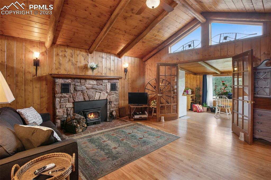 321 Dewell Road Woodland Park, CO 80863 - Photo 14 of 32 a living room with furniture and a fireplace