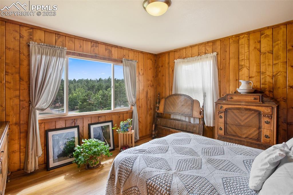 321 Dewell Road Woodland Park, CO 80863 - Photo 29 of 32 a bedroom with a bed and a large window