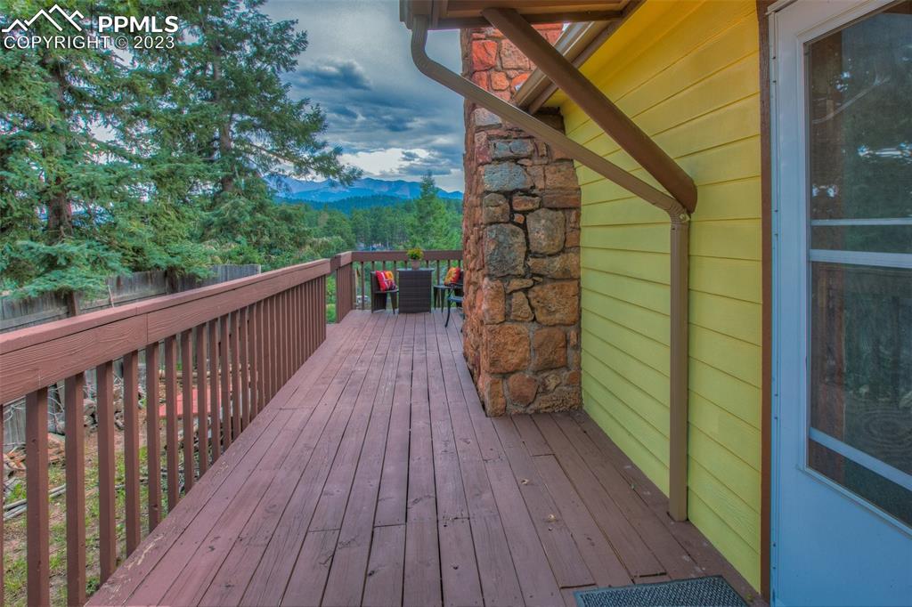 321 Dewell Road Woodland Park, CO 80863 - Photo 31 of 32 a view of deck with wooden floor and bench