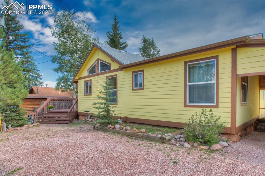 321 Dewell Road Woodland Park, CO 80863 - Photo 10 of 32 a view of a house with a yard and sitting area