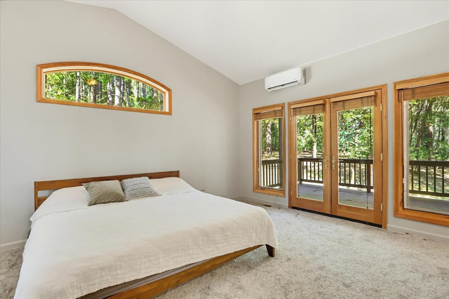 14517 North Bloomfield Road Nevada City, CA 95959 - Photo 25 of 78 a bedroom with a bed and a large window