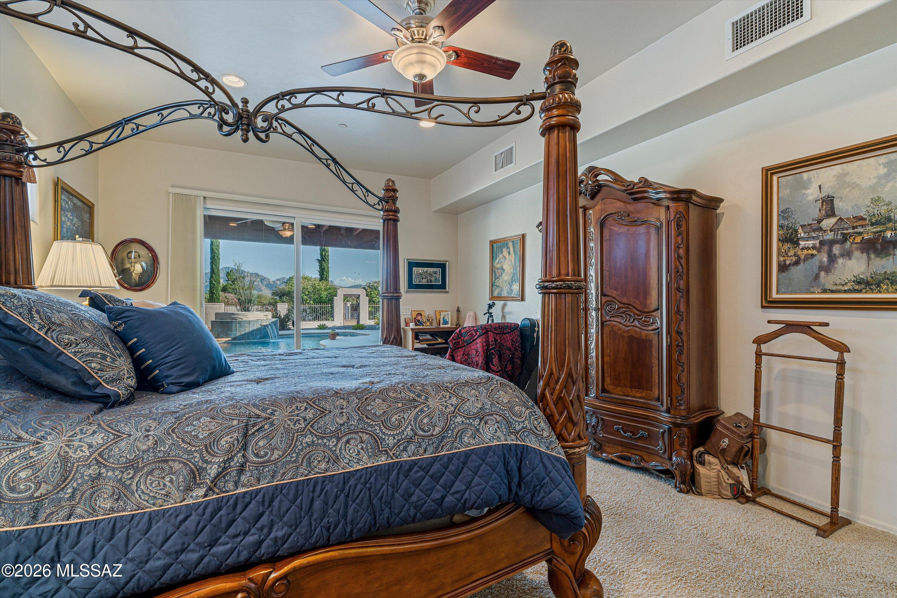 4677 East Rail N Road Tucson, AZ 85739 - Photo 13 of 48 eft from great room and kitchen is this en-suite, mountain views, walk in tiled shower, soaking tub, walk in closet and patio door to backyard oasis
