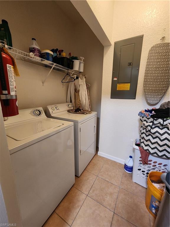 7512 Bristol Circle Naples, FL 34120 - Photo 15 of 22 a utility room with dryer and washer