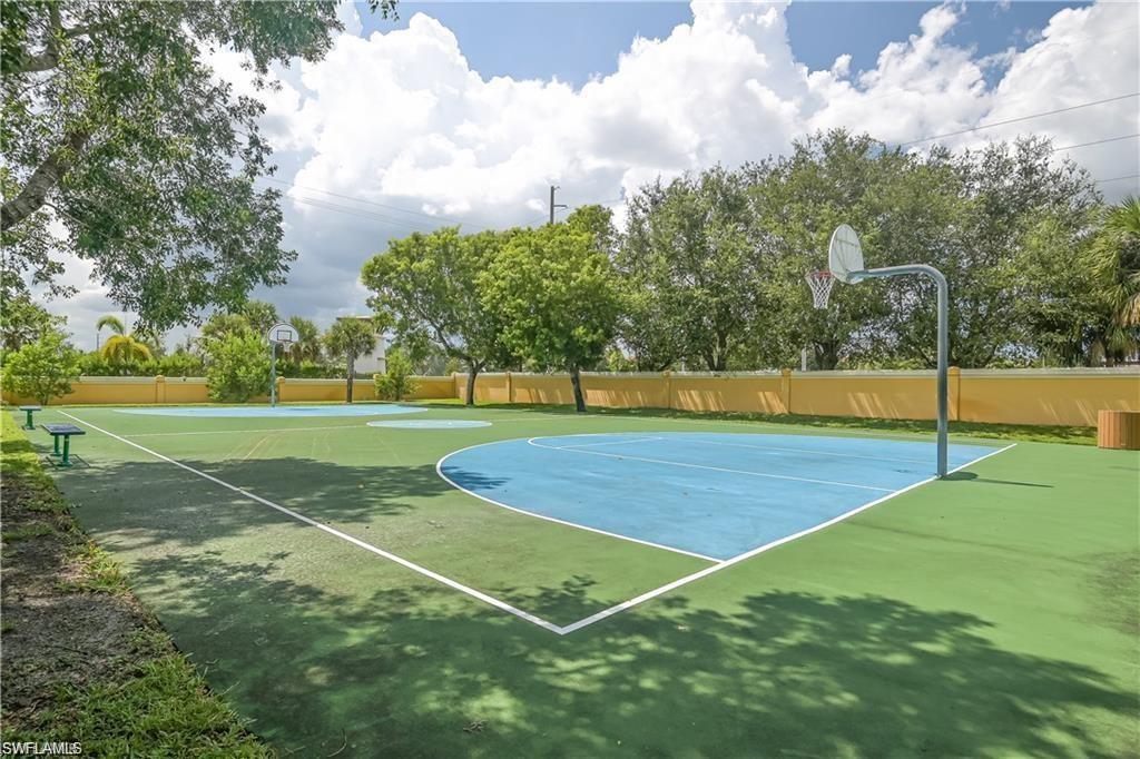 7512 Bristol Circle Naples, FL 34120 - Photo 20 of 22 a view of a tennis court