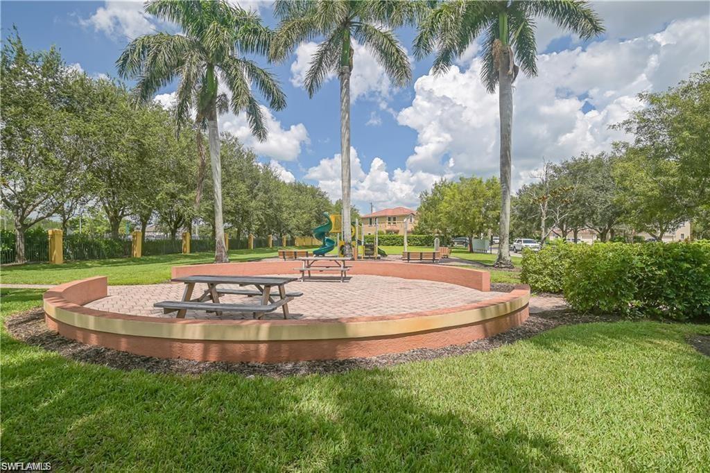7512 Bristol Circle Naples, FL 34120 - Photo 21 of 22 a view of a fountain in front of a house with a fountain