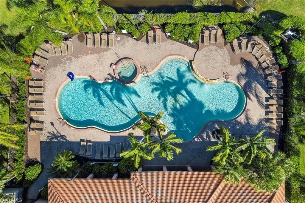 7512 Bristol Circle Naples, FL 34120 - Photo 3 of 22 an aerial view of a swimming pool