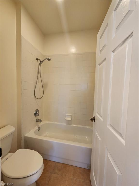 7512 Bristol Circle Naples, FL 34120 - Photo 10 of 22 a bathroom with a toilet and a bathtub