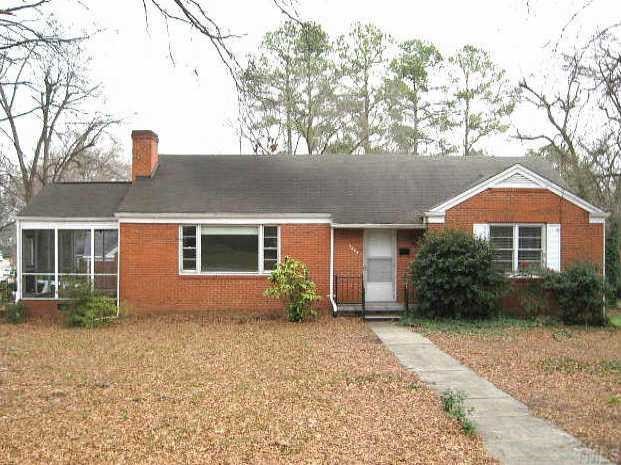 1334 Oberlin Road Raleigh, NC 27608 - Photo 1 of 12 a front view of a house with garden
