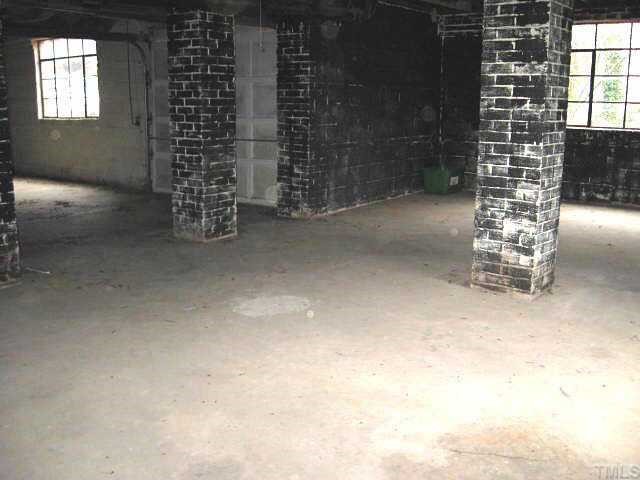 1334 Oberlin Road Raleigh, NC 27608 - Photo 11 of 12 a view of empty room with windows