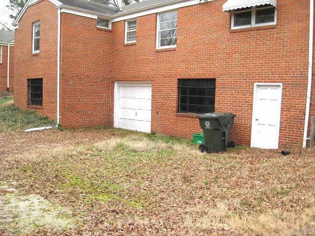 1334 Oberlin Road Raleigh, NC 27608 - Photo 12 of 12 a view of a brick house with many windows