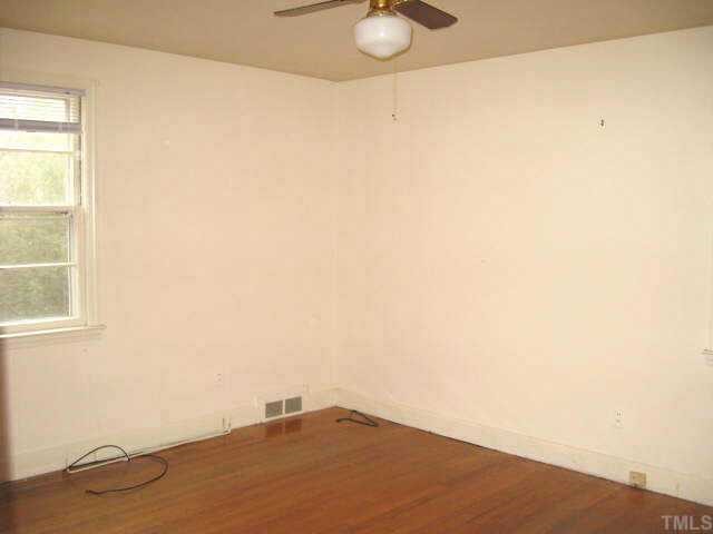 1334 Oberlin Road Raleigh, NC 27608 - Photo 6 of 12 a view of empty room with wooden floor