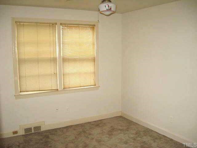 1334 Oberlin Road Raleigh, NC 27608 - Photo 9 of 12 an empty room with a window