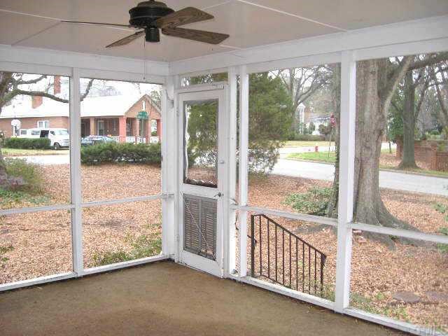 1334 Oberlin Road Raleigh, NC 27608 - Photo 10 of 12 a view of a glass door and a yard from a balcony