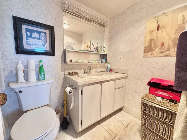 a bathroom with a toilet a sink and a shower