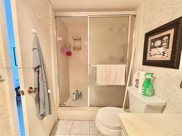 a spacious bedroom with a bed and a couch