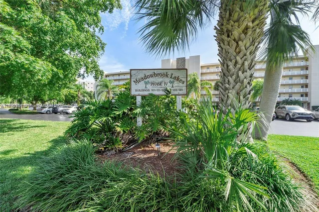 a view of a cars parked in front of a building