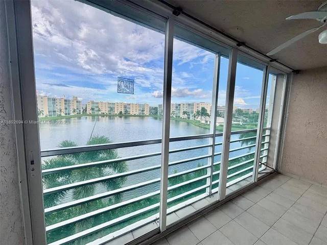 a view of a wooden deck with a yard