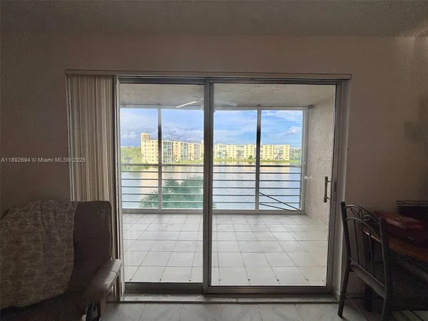 a view of an empty room and window