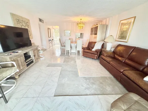 a kitchen with a stove a sink and a refrigerator