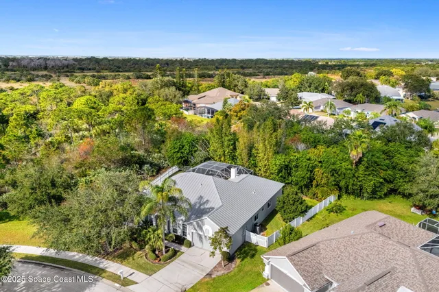 an aerial view of residential building and lake