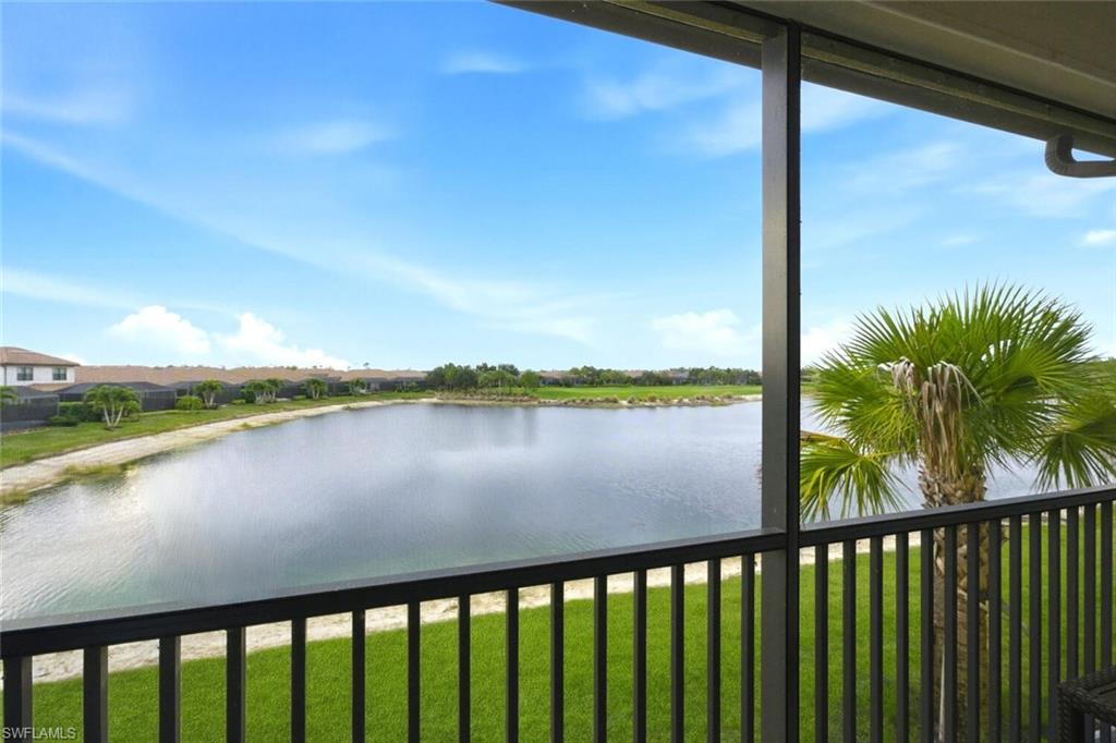 9365 Pocida Court, Unit 202 Naples, FL 34119 - Photo 28 of 40 a view of a lake from a balcony