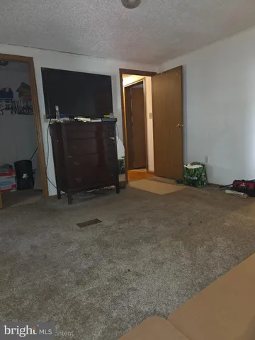 a bathroom with a sink mirror vanity and a toilet