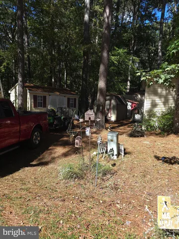 a view of a backyard with a patio