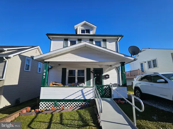 a front view of a house with parking