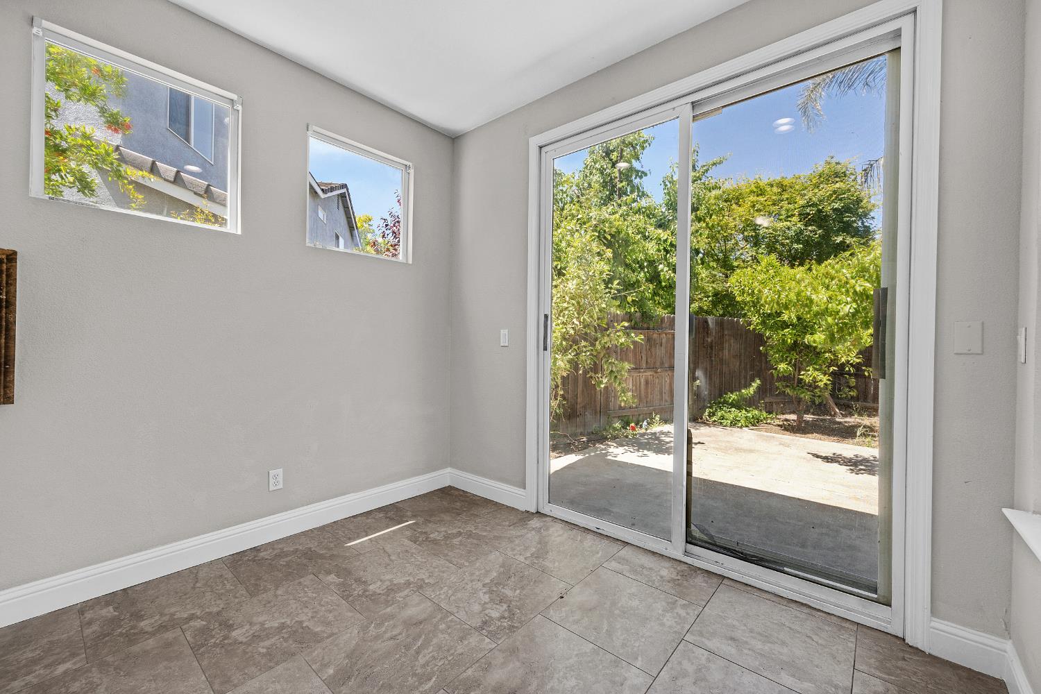 2963 Rugby Court Tracy, CA 95377 - Photo 11 of 40 a view of empty room with floor to ceiling window
