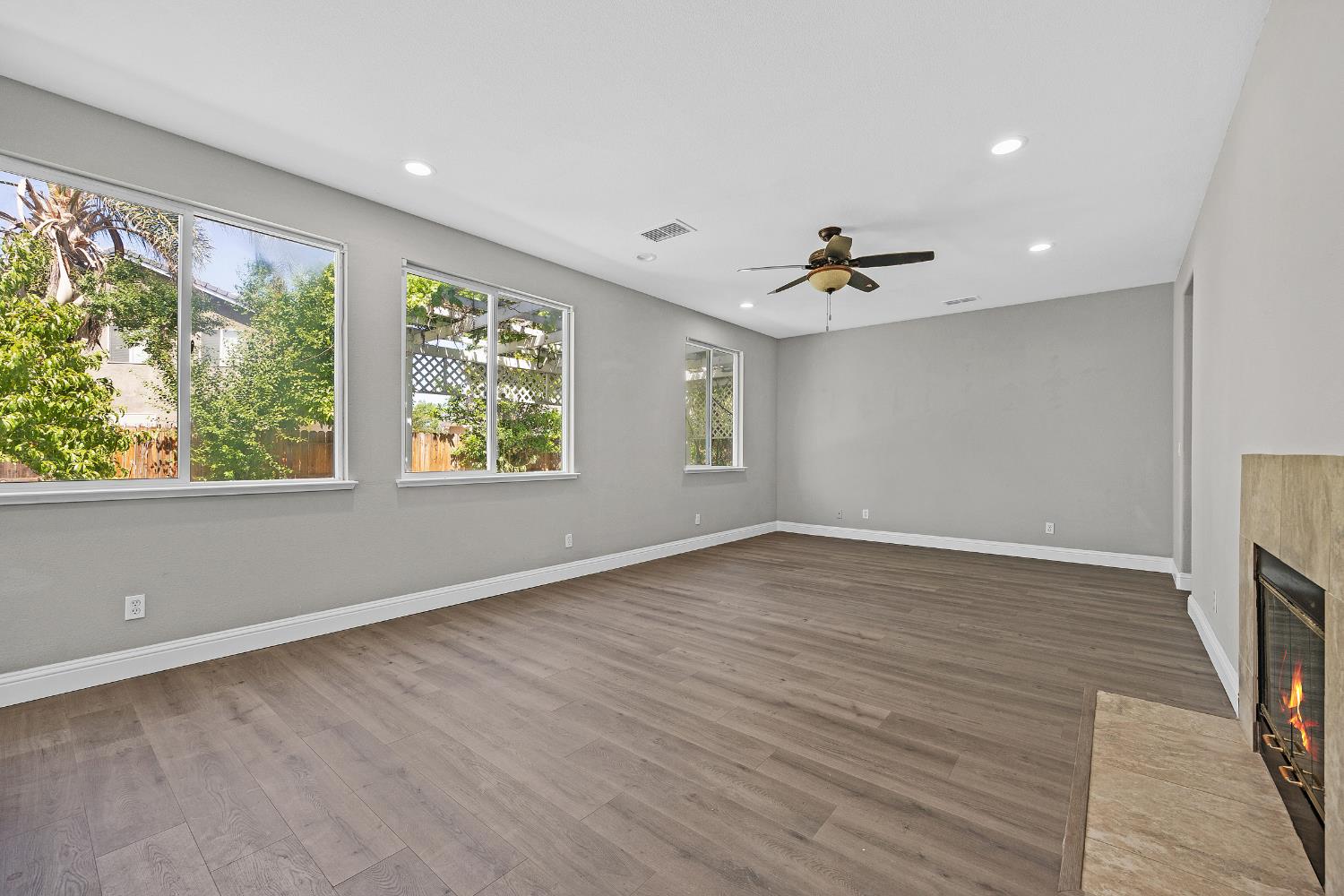 2963 Rugby Court Tracy, CA 95377 - Photo 13 of 40 wooden floor in an empty room with a window
