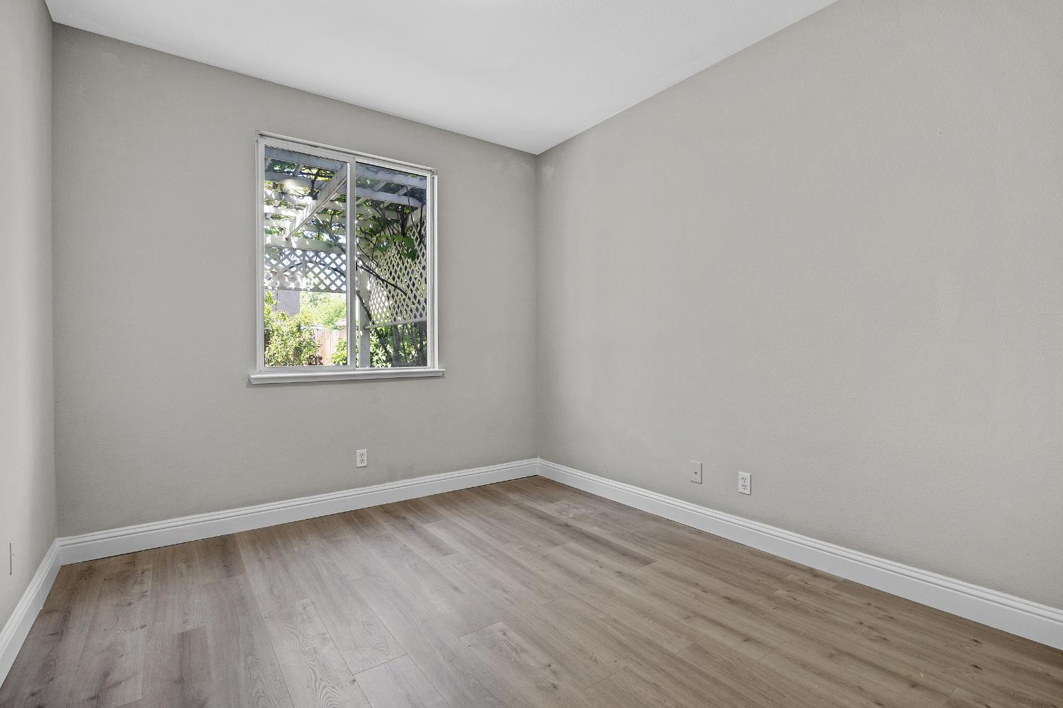 2963 Rugby Court Tracy, CA 95377 - Photo 16 of 40 a view of room with wooden floor and window
