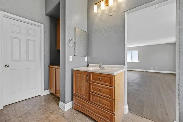 a bathroom with a sink and a mirror