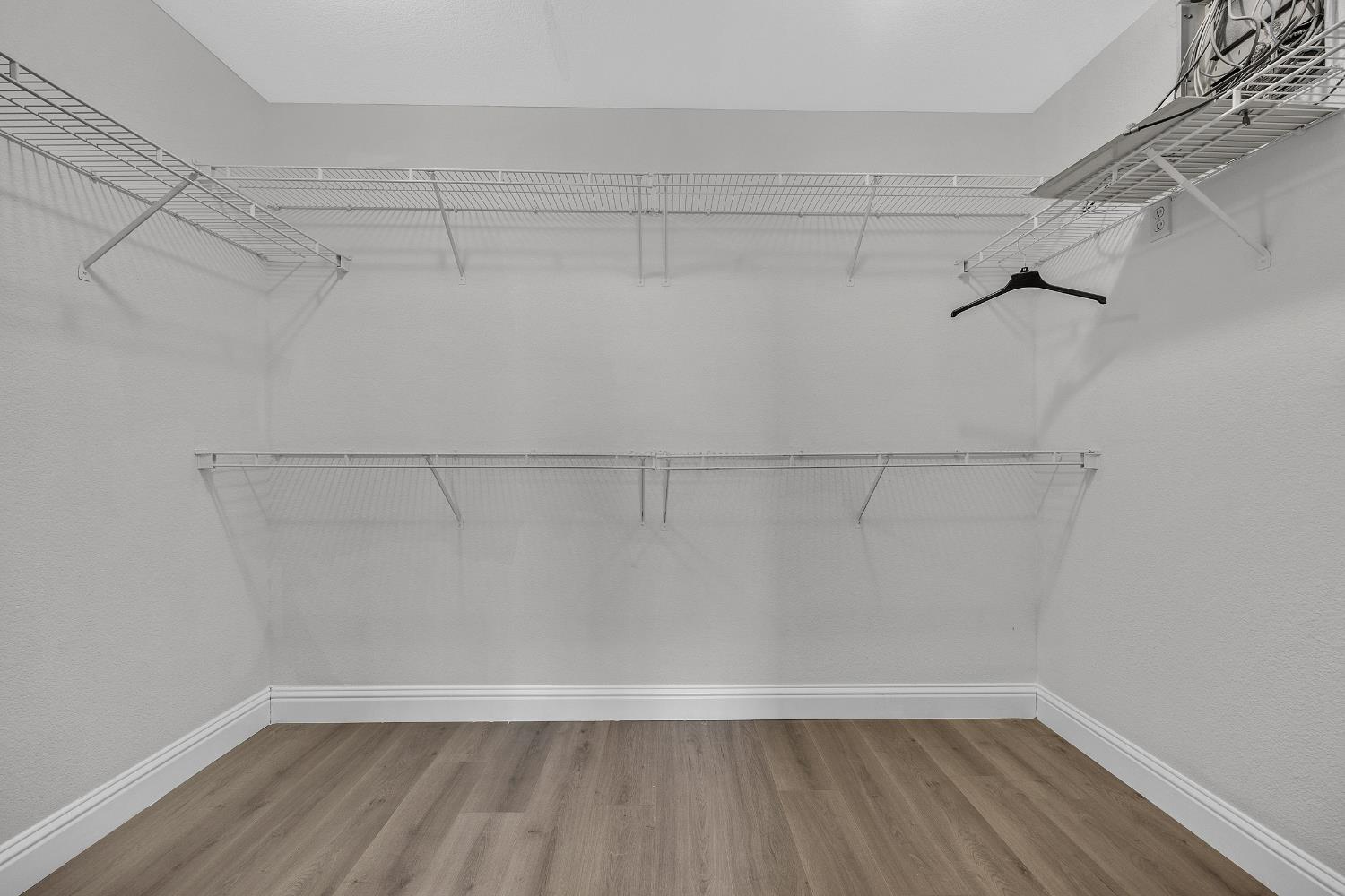 2963 Rugby Court Tracy, CA 95377 - Photo 26 of 40 a view of a room with racks on the wall