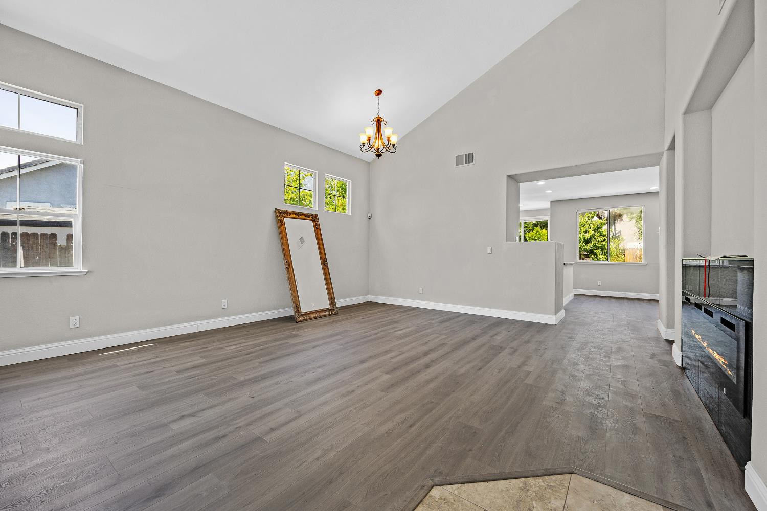2963 Rugby Court Tracy, CA 95377 - Photo 3 of 40 wooden floor in an empty room with a window