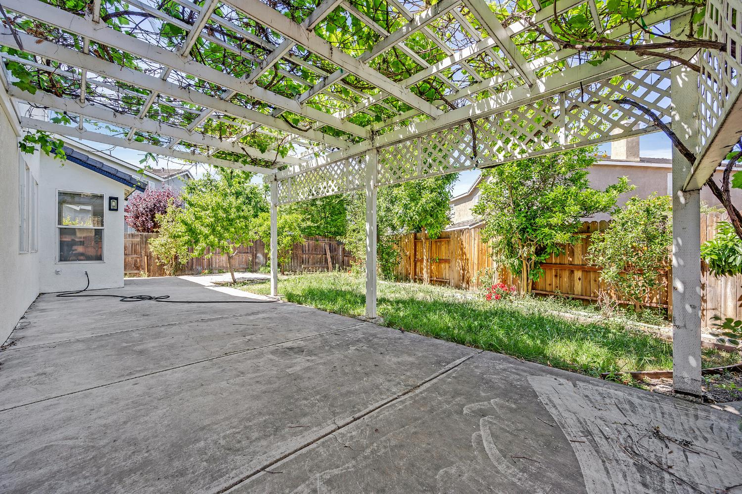 2963 Rugby Court Tracy, CA 95377 - Photo 35 of 40 a view of a house with a tree and plants