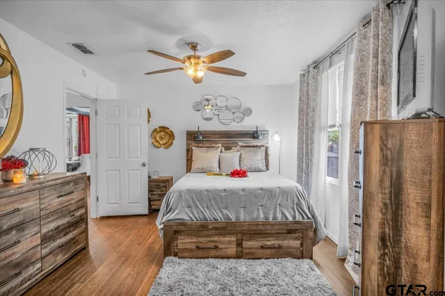 a bedroom with a bed and a dresser