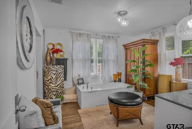 a bathroom with a sink a toilet and a shower curtain