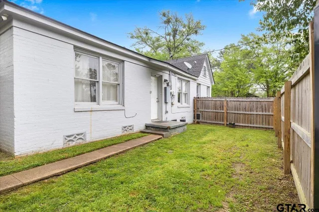 a house view with a garden space