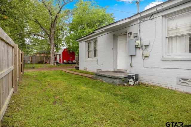 a view of a backyard with a sitting area