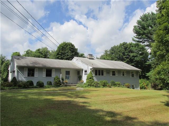 75 Hobby Drive Ridgefield, CT 06877 - Photo 1 of 1 a front view of a house with garden