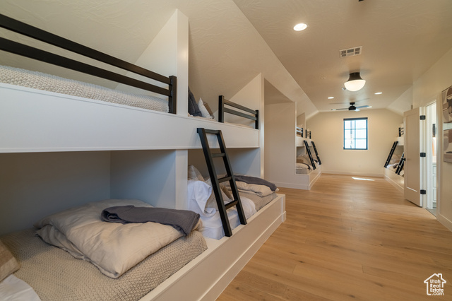 5366 Cyan Lane St. George, UT 84790 - Photo 33 of 39 Bedroom featuring light wood-style floors, lofted ceiling, and recessed lighting