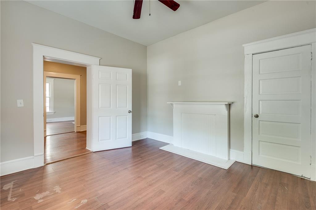 1330 Allene Avenue Southwest Atlanta, GA 30310 - Photo 3 of 11 an empty room with wooden floor and closet