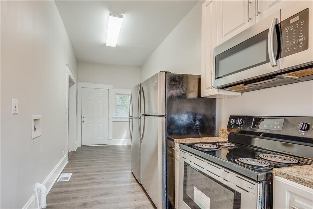 1330 Allene Avenue Southwest Atlanta, GA 30310 - Photo 7 of 11 a kitchen with a stove and a microwave