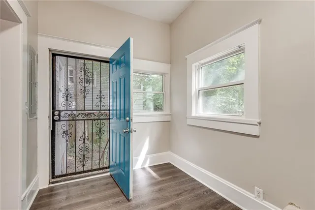a view of entryway with wooden floor
